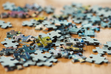 Paperboard  jigsaw pieces in close up. Macro photography of a jigsaw puzzle.