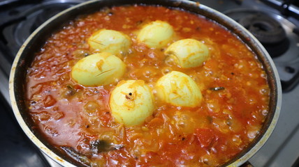 cooking pot of tomato and Eggs