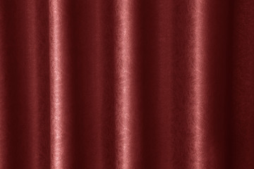 luxurious wavy red fabric texture surface curtain wave with a pattern background. macro texture of red striped fabric