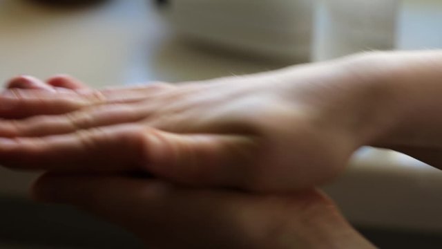 Woman applies hand sanitizer Close Up