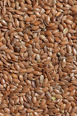 A solid background of peeled flaxseed