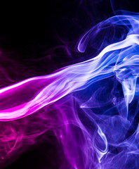 Fototapeta premium Colored smoke on black background