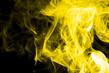 Yellow smoke on black background