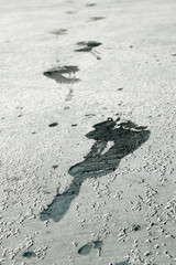 Wet footprint on concrete floor 
