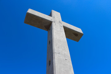Large cross monument in Filerimos, Rhodes island, Greece on the blue sky background.