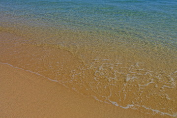 Fototapeta na wymiar Close up of the water at a beach.