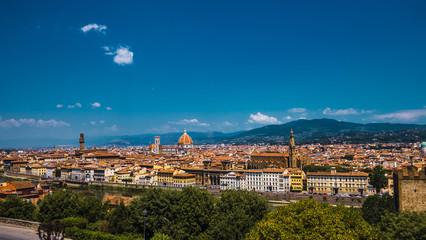 Fototapeta premium Beautiful aerial landscape of the city of Florence, Italy with various houses and church at sunset 
