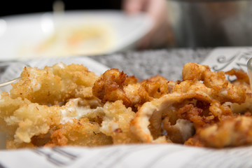 fried breadcrumbs with crispy crust. Snack on plates close-up in a restaurant or cafe.
