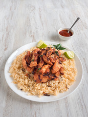 Homemade chicken Biryani. Arabic traditional food bowls Kabsa with meat