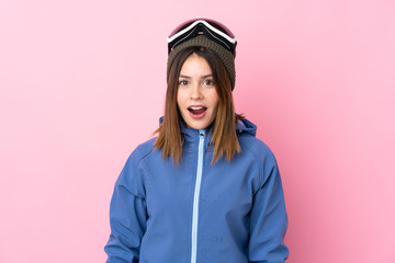 Young skier woman over isolated pink background with surprise facial expression