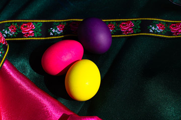 Painted Easter eggs in a nest of straw. Sunlight. Easter still life. - 336483119