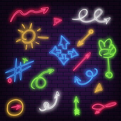 Set of neon arrows of different colors on a dark brick wall background. Vector illustration EPS 10.