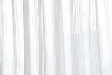 white curtain wavy with a pattern background. transparent curtain on window