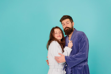 Sleepy people blue background. Couple sleepy faces domestic clothes. All day pajamas. Couple in love bathrobes. Drowsy and weak in morning. Advice relationships surviving quarantine. Morning routine