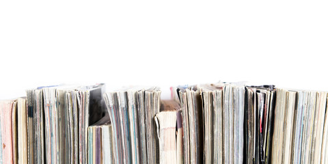 A stack of old magazines on a white background. Space for text or design