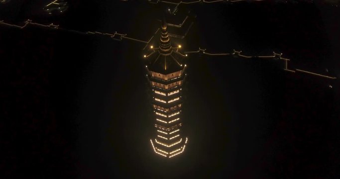 Night Aerial Circle Ascending Reveal Shot of Xa Loi stupa at Bai Dinh Temple Spiritual and Culture Complex in Ninh Binh Vietnam, the largest spiritual tourist place in Vietnam