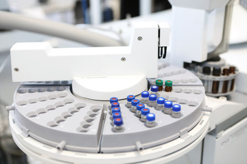 Quality Control Laboratory medicine. Chromatograph operation. A woman makes an analysis on a gas chromatograph. Development of a new vaccine against the covid-19 virus.