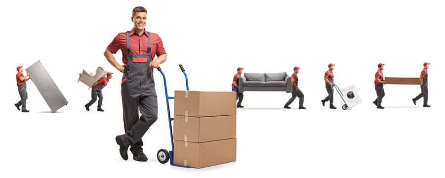 Male worker with boxes on a hand-truck and other carrying furniture