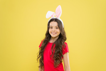 spring holiday tradition. schoolgirl have fun. celebrate traditional feast. Easter bunny costume. funny little girl in rabbit ears. happy childhood. Cheerful kid celebrate easter holiday