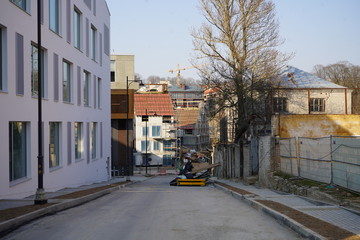 New narrow street with trash container in new buildings district