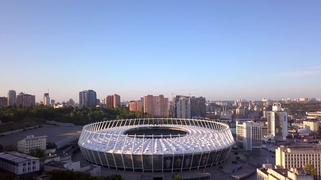 The drone takes off over the football stadium, which is located in the center of the city. Spring, morning. Kiev, Ukraine.