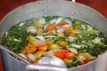 Metal pot with Cambodian vegetarian soup