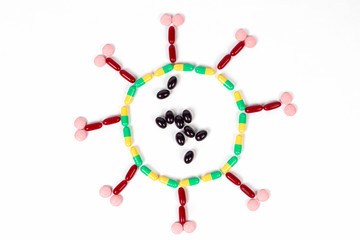 Coronavirus made of medicines, white color background. Art negative photography