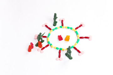 Army soldiers  atacking coronavirus made of pills. Civilian 
gummy bears prisoners 