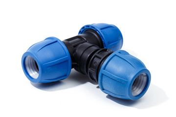 Various plastic fittings for polypropylene pipes on a white background - Image