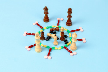 The pawns are inside coronavirus made of pills, black king and queen watching closely. top angle...