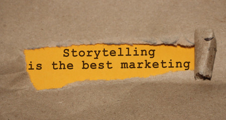 Storytelling id the best marketing written under torn paper. Advertising storytelling copywriting...