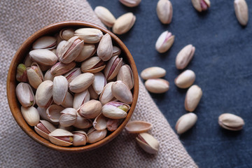  Close up of pistachios on hand, healthy eating 