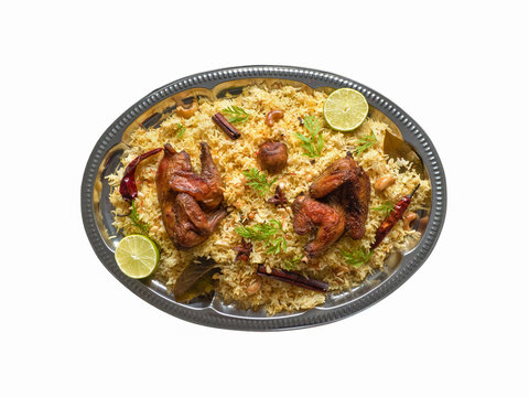 Isolated chicken Biryani. Arabic traditional food bowls Kabsa with meat