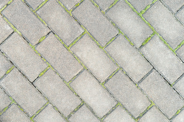 gray paving slabs on a diagonal. footpath background