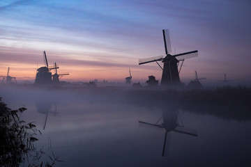 windmills at sunset