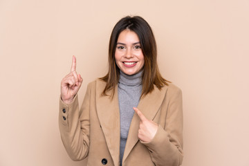 Young woman over isolated background with surprise facial expression