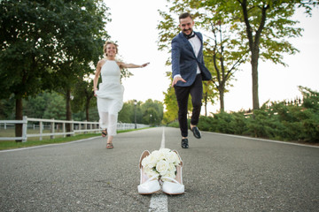 Newlyweds run to distill for a bouquet of brides