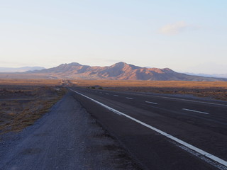 Morning road and mountains in the Atacama Desert, San Pedro de Atacama, Chile