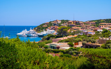 Porto Cervo, Sardinia, Italy - Panoramic view of luxury yacht port, marina and residences of Porto...