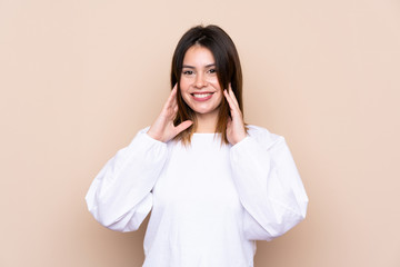 Young woman over isolated background with surprise facial expression