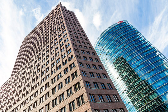 BERLIN, GERMANY - SEPTEMBER 22, 2017: Kollhoff Tower (Left) and Bahn Tower on Potsdamer Platz, Berlin, Germany. Potsdamer Platz is a central financial district of Berlin with modern skyscrapers