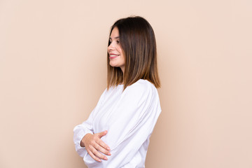 Fototapeta premium Young woman over isolated background looking to the side