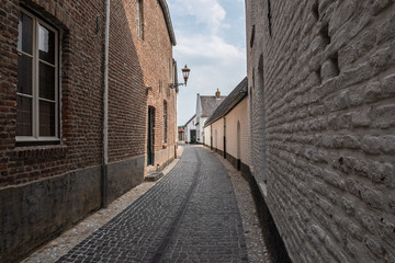 Fototapeta na wymiar Empty narrow street in the center of the old Dutch city