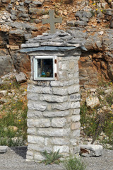 Small stone church in the mountain roads near Monodendri