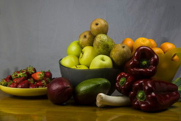 bowls of fresh fruits on wooden table