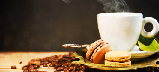 Coffee cup and beans on old kitchen table.