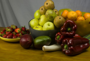 bowls of fresh fruits on wooden table