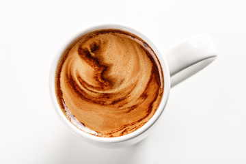 Top angle of delicious americano lungo coffee in white ceramic mug. White background. Highest quality of coffee ground. Content for coffee addicted guys