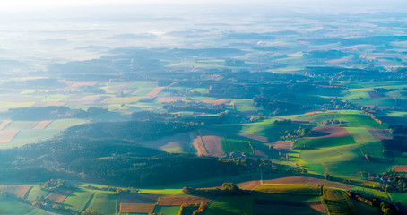 Fototapeta premium Aerial view of blurred background with beautiful fields in Bavaria, Germany