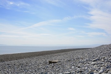 BARRY, VALE OF GLAMORGAN / WALES - APRIL 15 2020: elderly people take daily exercise in the sunshine during the COVID_19 lockdown making sure they are complying with social distance rules